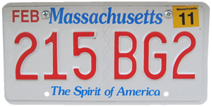 A Massachussetts license plate. The background is white. The name of the state is in blue lettering, as is the slogan ('The Spirit of America'). The registration number is in large red text ('215 BG2'). There are also some other text ('Feb' and '11') in the top corners; I don't know what those mean.